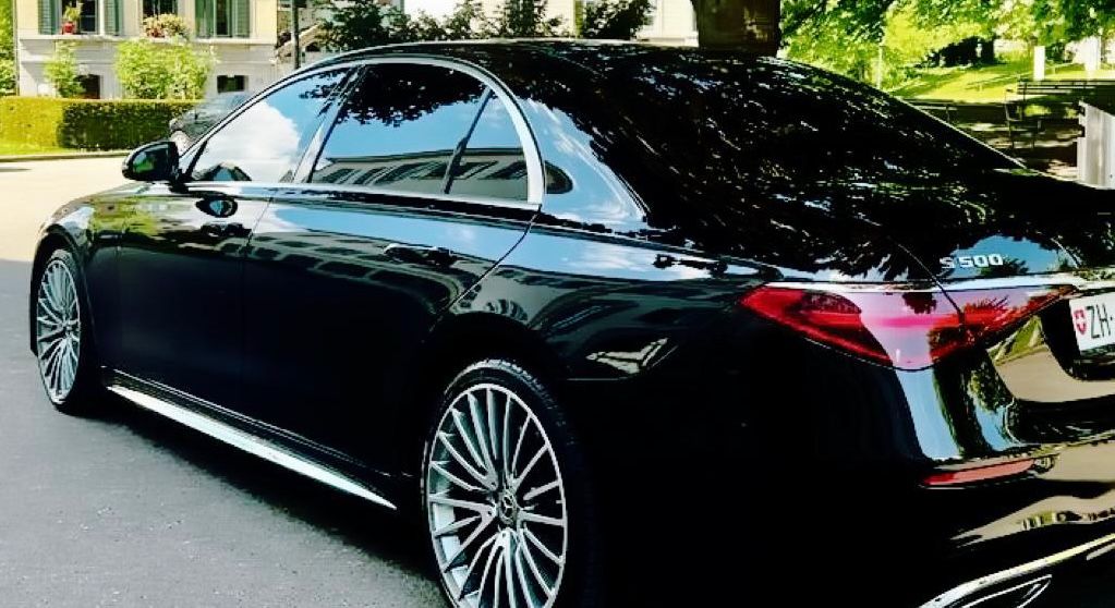 Mercedes S-Class black limousine with professional chauffeur servic