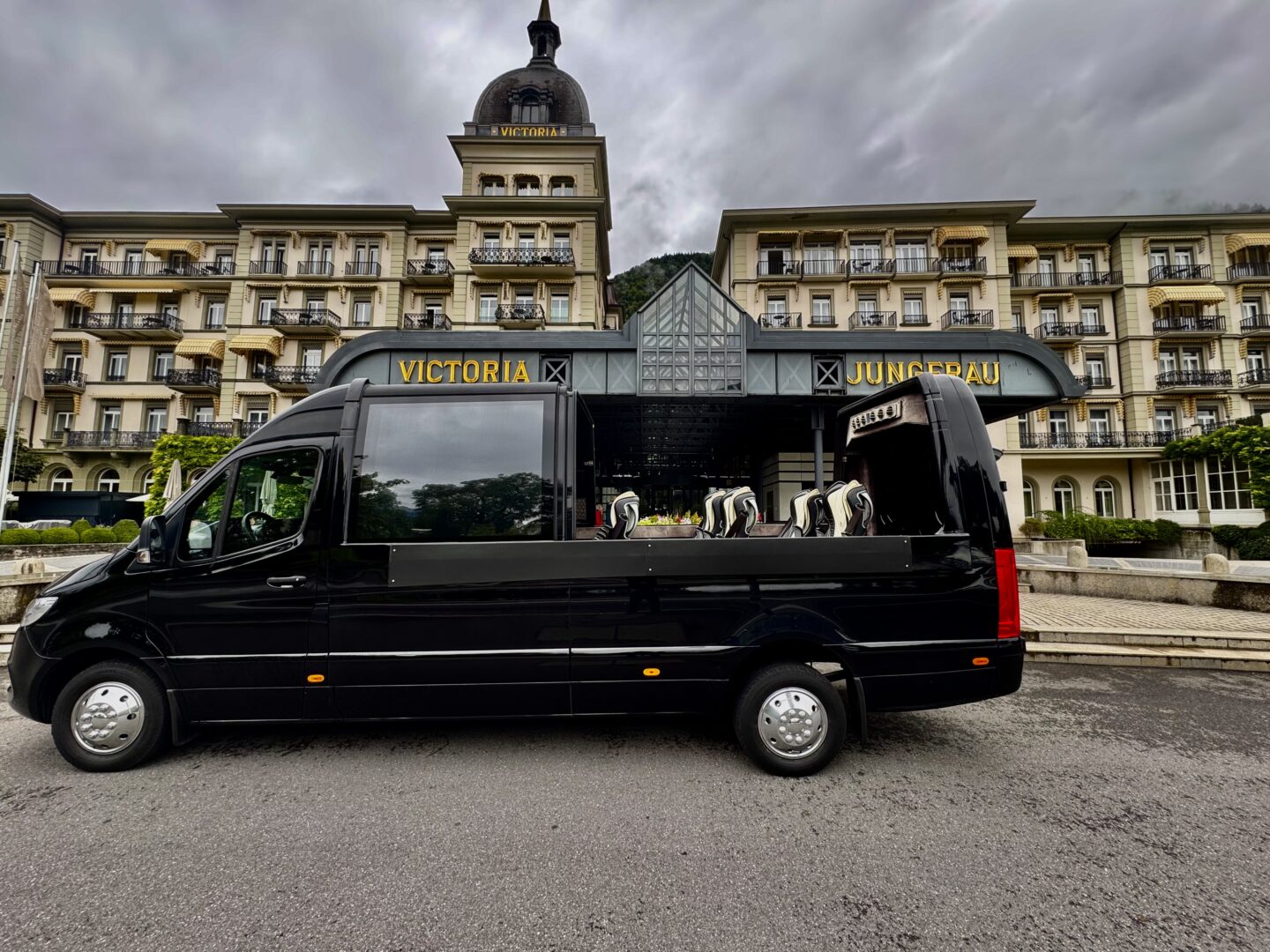 Luxury Mercedes Sprinter Cabriolet for private airport transfer between Zurich Airport and Victoria Jungfrau Hotel in Interlaken – Black Car Service for tourists and groups up to 14 passengers