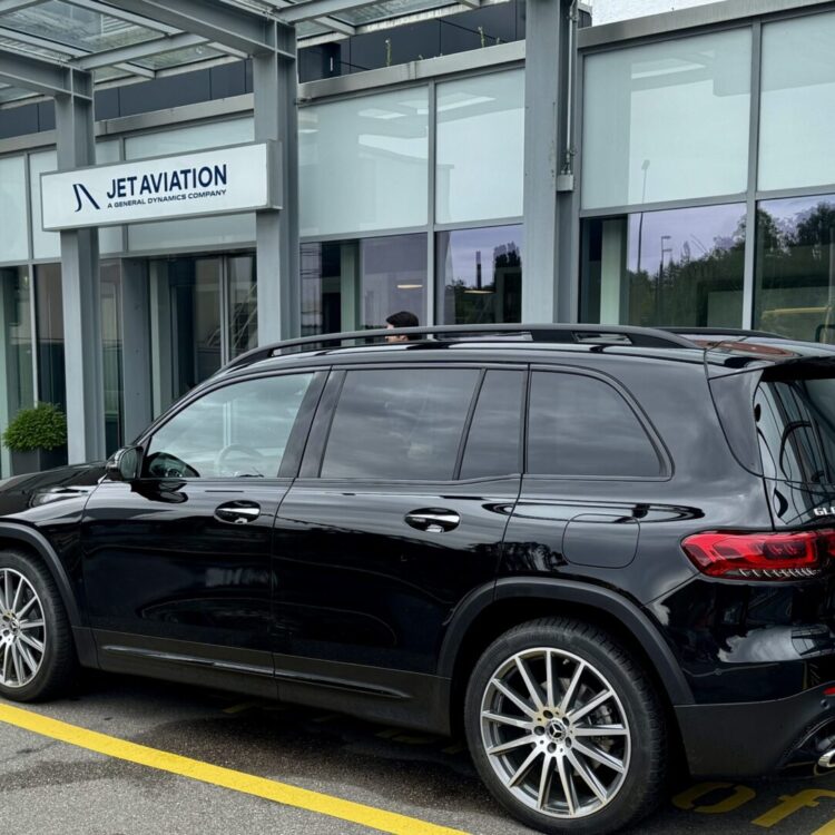 Globetransporte Mercedes GLB black car picking up 3 private jet crew from Jet Aviation at Zurich Airport for VIP transfer to Interlaken.
