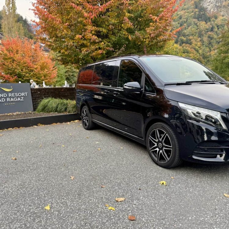 Luxury Mercedes-Benz van parked near Grand Resort Bad Ragaz in autumn.