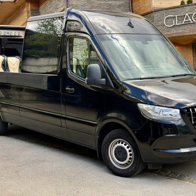Cabrio Panorama Sprinter parked in front of Boutique Hotel & Restaurant Glacier for a private luxury tour to Interlaken, Jungfrau, and Brienz with American tourists