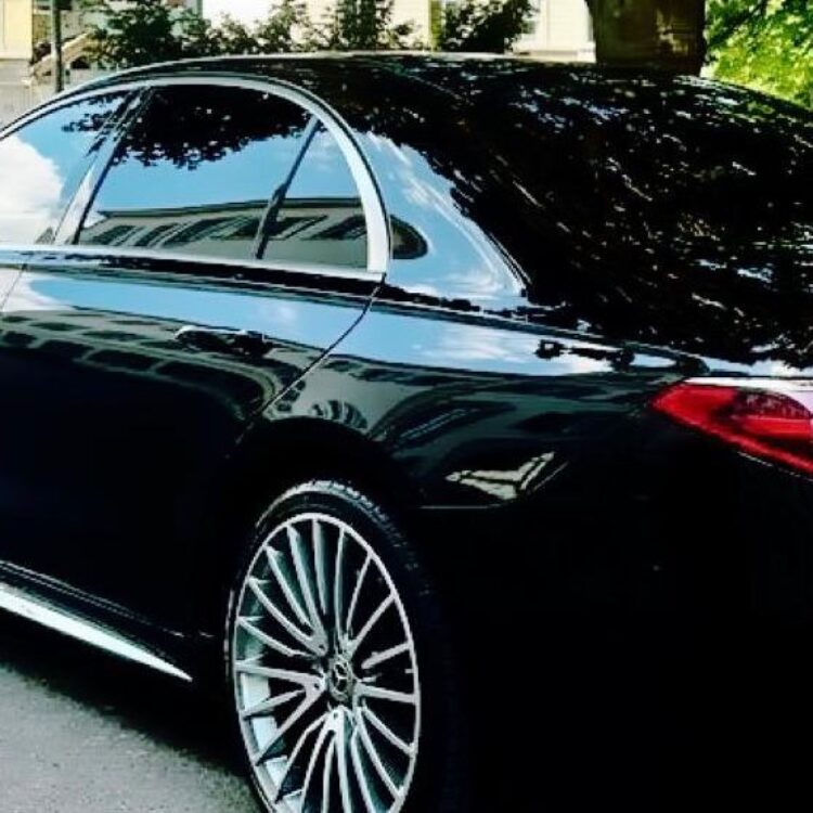 Mercedes S-Class black limousine with professional chauffeur servic