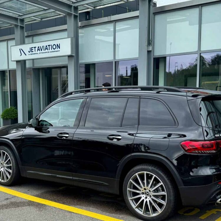 Luxurious black Mercedes-Benz SUV at Zurich Airport for premium limousine transportation.